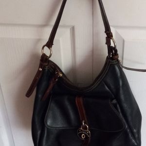 Dooney Bourke black leather handbag. Includes coin purse.. Excellent condition.